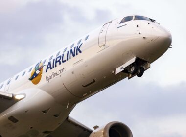 a_low_angle_shot_of_an_airlink_airplane_flying_over_nelspruit_south_africa_feb_19_2022-min.jpg