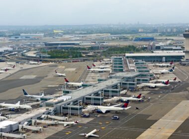 Aerial view of JFK airport terminal, tower and apron