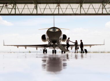 Silhouette,Of,Pilot,Greeting,Businessman,And,Businesswoman,Boarding,Private,Jet